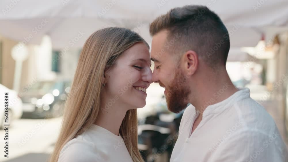 Man and woman couple smiling confident hugging each other at street Man and woman couple smiling confident hugging each other at street