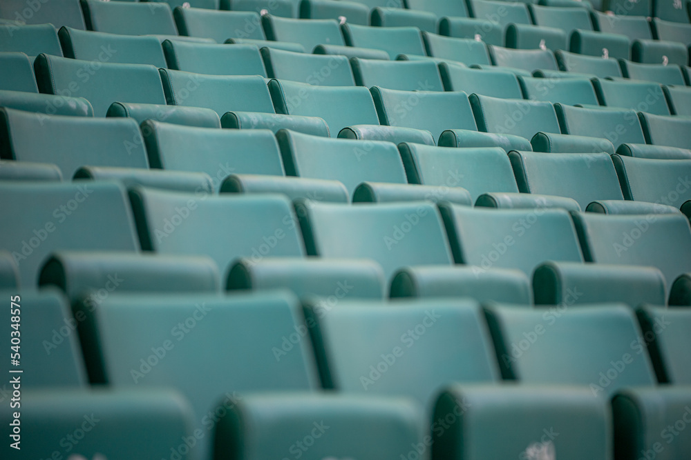 The empty seats of the stadium await match day