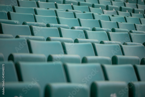 The empty seats of the stadium await match day
