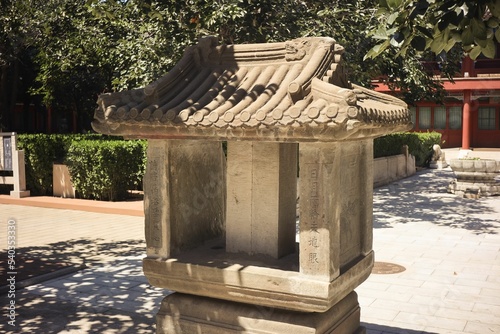 Closeup of a carved stone artwork in shape of a temple in Zhenjue Temple, China photo