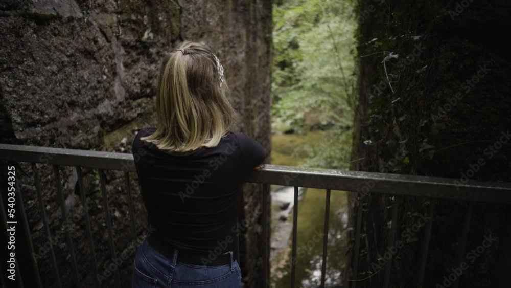 Blond Girl At The Abandoned Building Of Gunpowder Works In Kennall Vale Nature Reserve, Ponsanooth, Truro, United Kingdom. Medium Shot