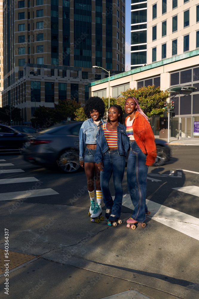 Portrait of young friend group together in the city on rollerskates
