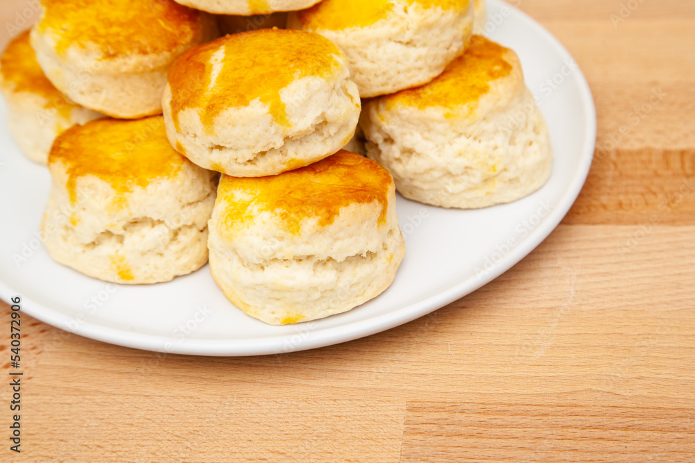 Homemade British Scones with clotted cream and raspberry jam Homemade British Scones with clotted cream and raspberry jam