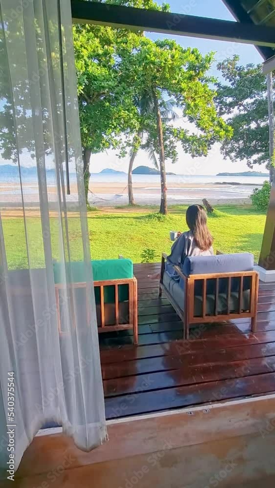 Young men waking up in a beach bungalow on a tropical beach. Young men