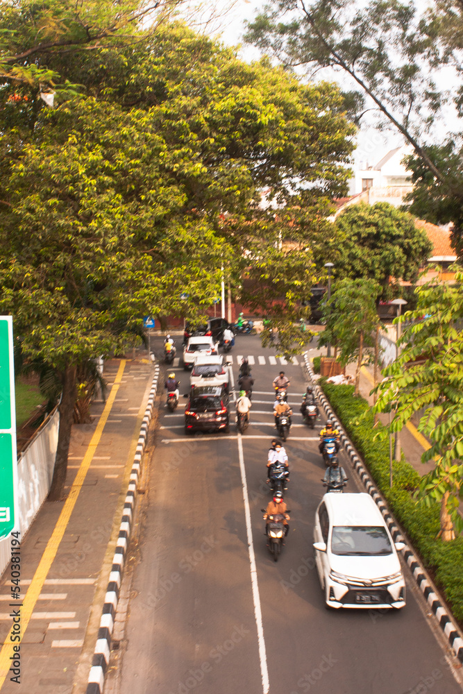 traffic in the city Green city of the future. Harmony of city and nature. Sunny day in the big city