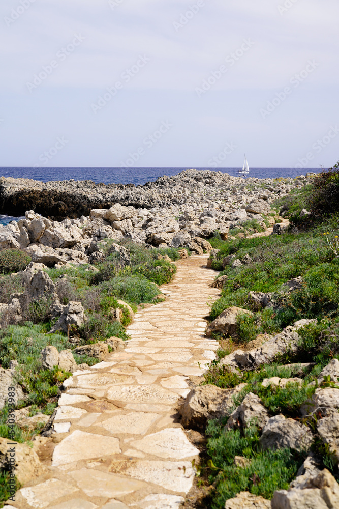 pathway stones tiles to access water sand beach in south Antibes Juan-les-Pins France