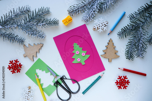 making greeting cards for christmas and new year. Children's DIY concept. Handmade crafts on holiday