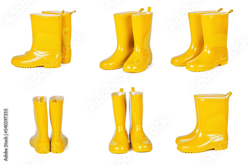Set of yellow rubber boots isolated on white background photo