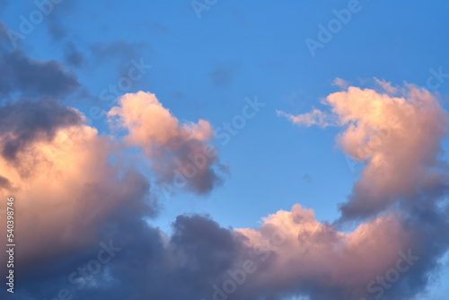 Fluffy clouds with colorful light in the evening