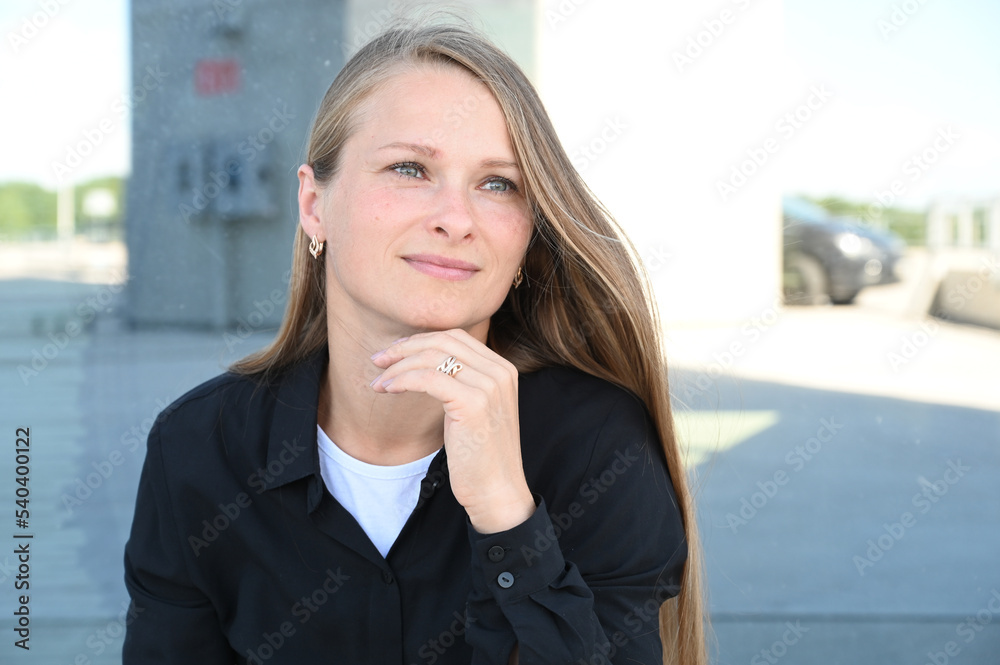 Close up portrait of beauty woman with fluttering white hair outdoors. Flying blonde hair on the wind Close up portrait of beauty woman with fluttering white hair outdoors. Flying blonde hair on the wind