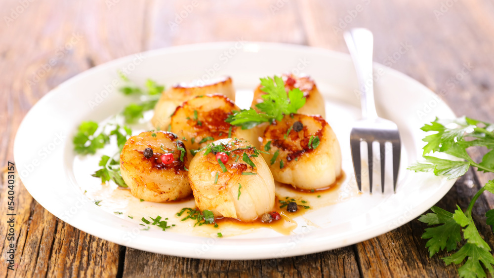 seared scallop with sauce and herbs seared scallop with sauce and herbs