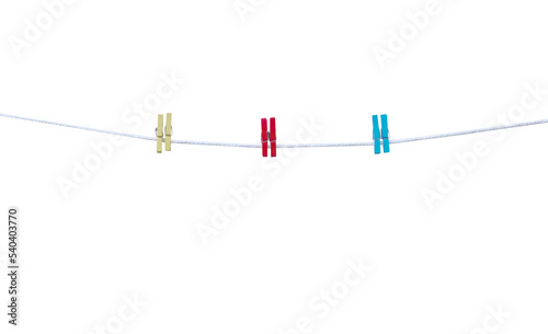 Wood clothes clip three pair color (red blue yellow)patterns hanging on white string line isolated on white frame background , clipping path for picture album or documentation