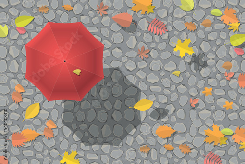 Vector illustration. Red umbrella on the stone pavement. Falling autumn leaves. Top view.