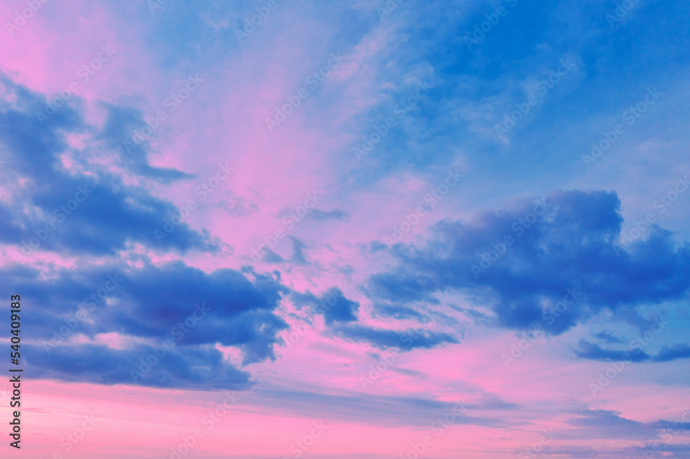 Pink-blue cloudy sky at sunset. Gradient color