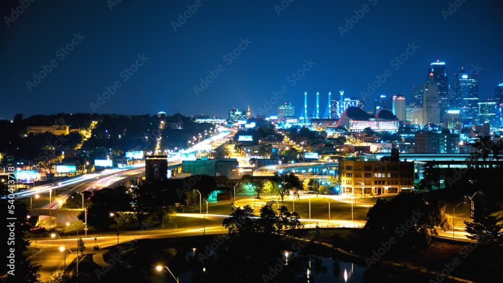 Panning Time Lapse Shot Of Long Exposure Of Vehicles Moving On Roads In Modern City At Night - Kansas City, Missouri Panning Time Lapse Shot Of Long Exposure Of Vehicles Moving On Roads In Modern City At Night - Kansas City, Missouri