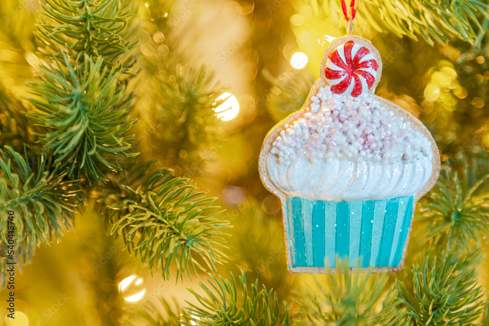 a cupcake on a Christmas tree, Christmas decoration a cupcake on a Christmas tree, Christmas decoration