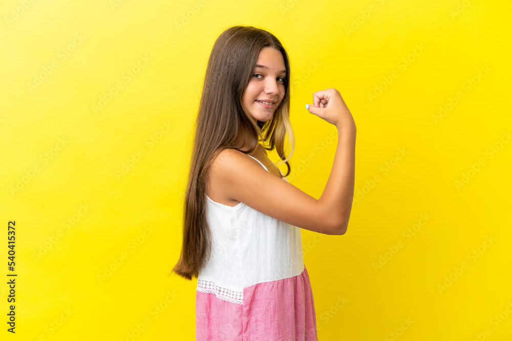 Little caucasian girl isolated on yellow background doing strong gesture Little caucasian girl isolated on yellow background doing strong gesture