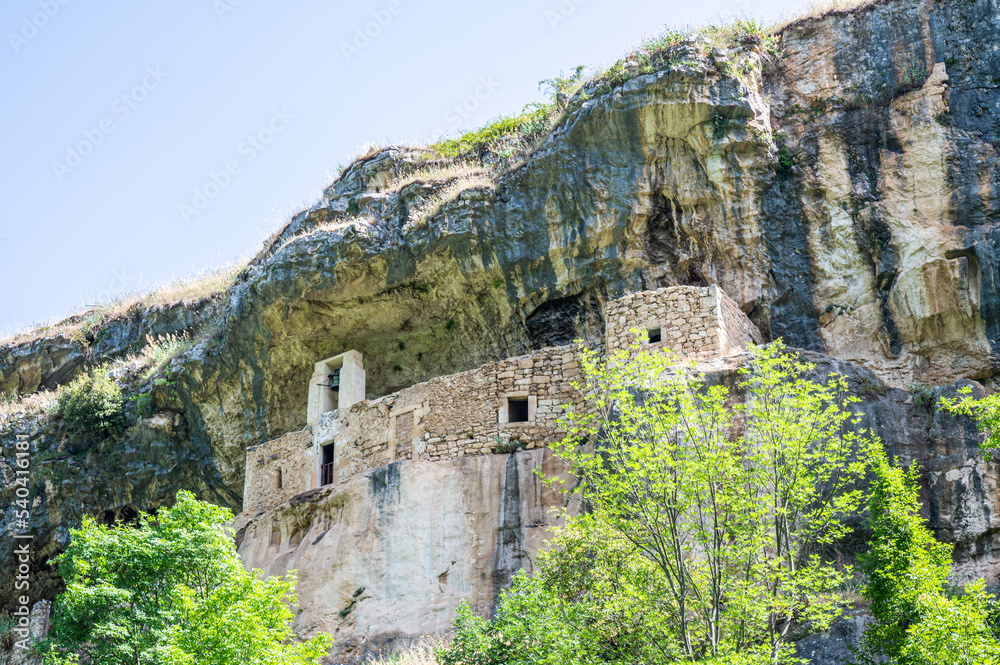 The panorama of the Hermitage of San Bartolomeo in Legio built with stones and carved into the rock