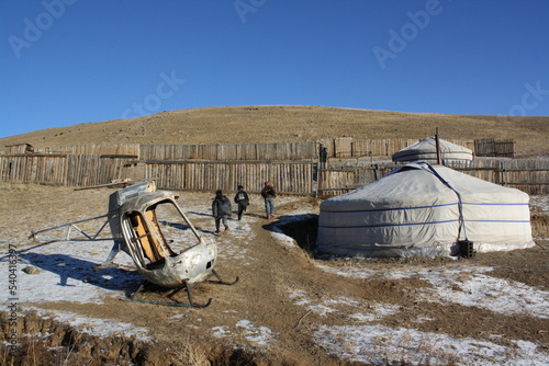 The Mongol gers (tents), kids, and the mini helicopter wreck in Chingeltei valley, Ulaanbaatar, Tuv, Mongolia. The Mongol children live in gers all the time. There is a time for them to go out. 