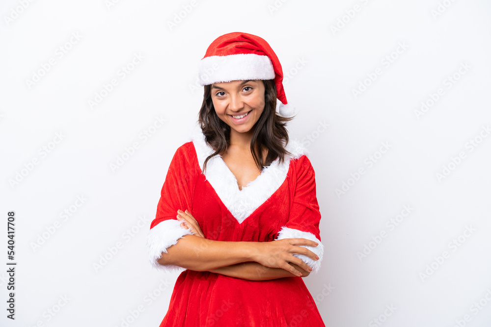 Young hispanic woman dressed as mama noel isolated on white background with arms crossed and looking forward Young hispanic woman dressed as mama noel isolated on white background with arms crossed and looking forward