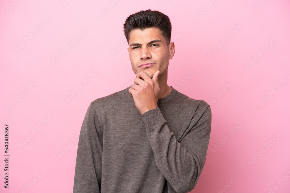 Young caucasian man isolated on pink background thinking Young caucasian man isolated on pink background thinking