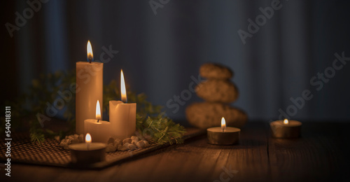 Spa concept. spa decoration with stones, candles, towel and plant. Relaxation scene. 
