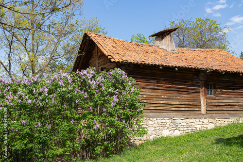 Traditional Georgian historic wooden house on sunny day