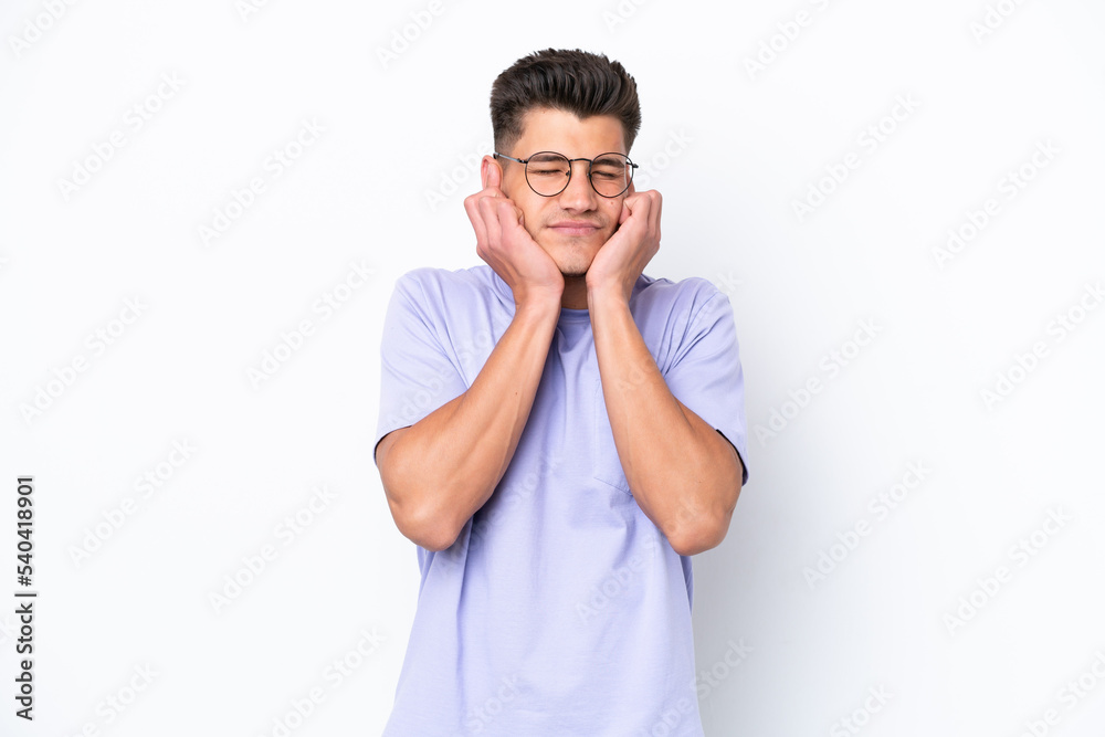 Young caucasian man isolated on white background frustrated and covering ears Young caucasian man isolated on white background frustrated and covering ears