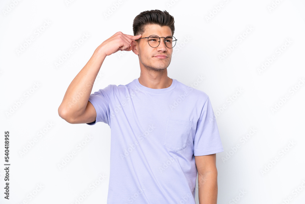 Young caucasian man isolated on white background making the gesture of madness putting finger on the head Young caucasian man isolated on white background making the gesture of madness putting finger on the head