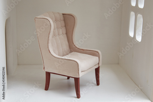 Armchair for a doll in a doll house. Miniature and roombox hobby.