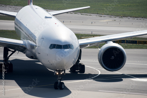 Fotografija Jumbo jet airplane airport tarmac closeup concept