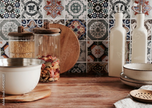 Kitchen utensils table Portuguese and Spain Azulejo tile background,trendy Eco style home still life. Space for text or menu . Business food brand template. 