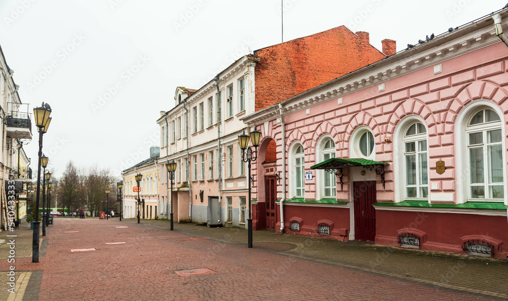 Fototapeta premium Pedestrian street with old houses in city centre in Vitebsk, Belarus
