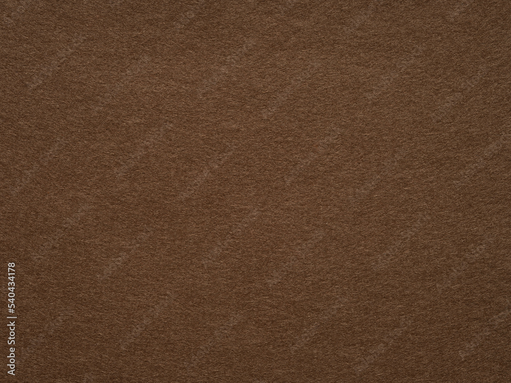 Dark brown felt, velvet texture. Soft background for text, lettering, patchworkor other art work. Full frame backdrop pattern wallpaper of art and stationery material in dark color. Natural felt.
