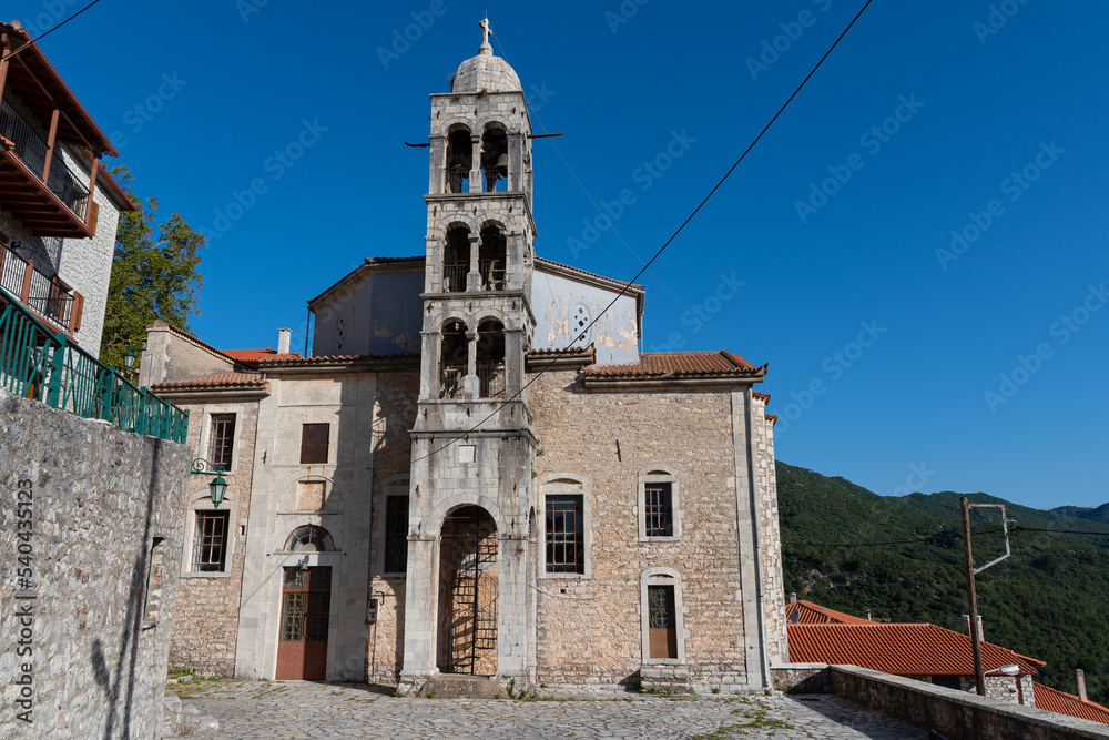 Fototapeta premium Taxiarchon church and bell tower in Dimitsana village, Arcadia, Greece
