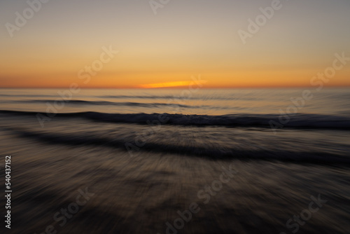 Abstract landscape on a beach at sunset