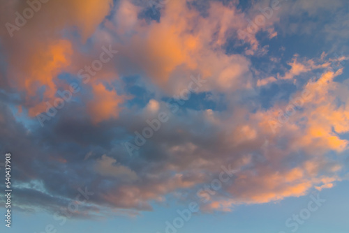 cumulus clouds fly over the blue sky at the evening, natural cloudy sky background