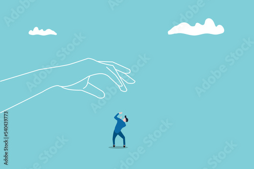 big hand trying to catch on his small worker or businessman. concept of under pressure. risk, financial, and tax.