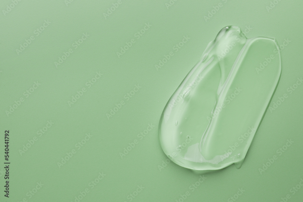 Sample of gel on green background, top view. Space for text Sample of gel on green background, top view. Space for text