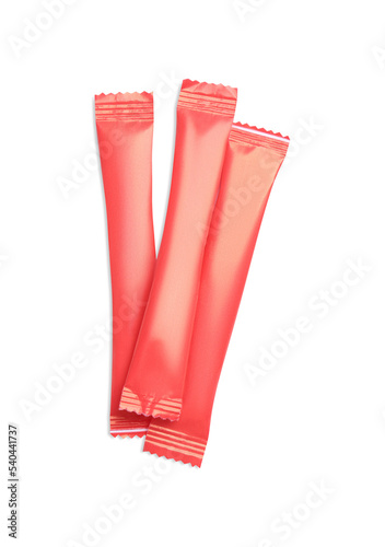 Red sticks of sugar on white background, top view