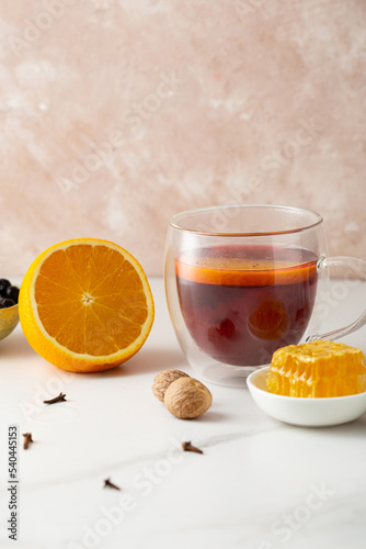 Fruit tea with orange slice and spice  nutmeg honey healthy food
