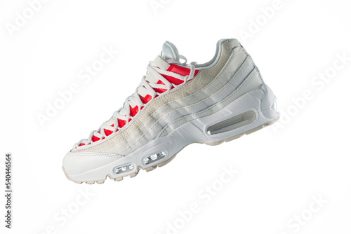 White sneaker with red accents on a white isolated background, men's fashion, sport shoe, air, sneakers, lifestyle, concept, product photo, levitation concept, street wear, trainer