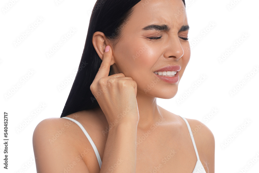 Young woman suffering from ear pain on white background, closeup Young woman suffering from ear pain on white background, closeup