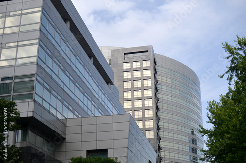 Exterior of beautiful modern skyscraper against blue sky