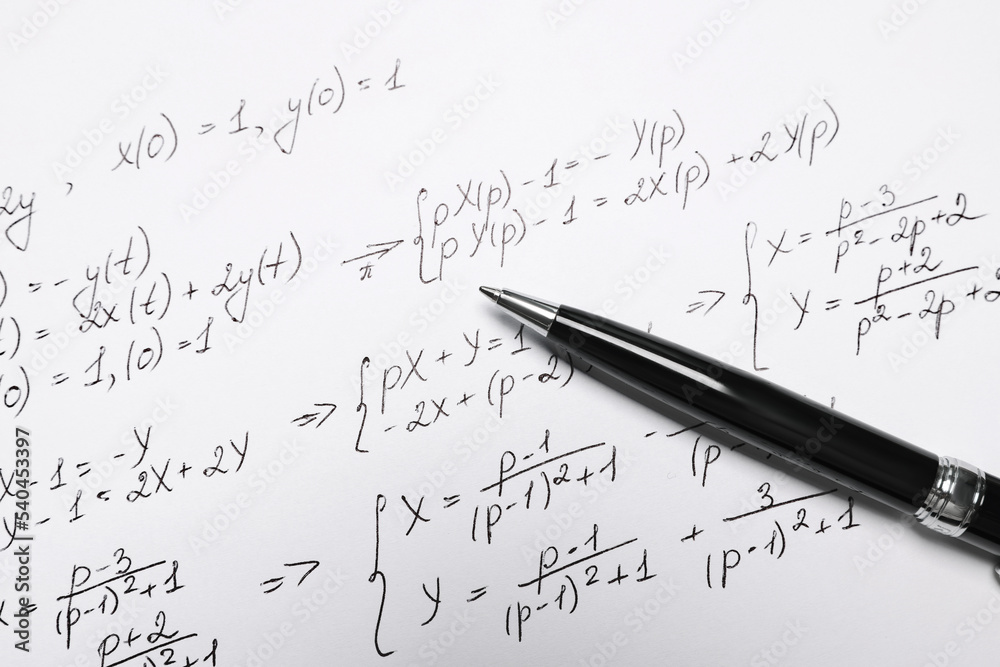 Sheet of paper with mathematical formulas and pen, closeup Sheet of paper with mathematical formulas and pen, closeup