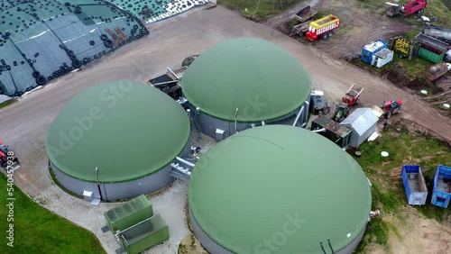 Aerial top down view over biogas production plant. Obtaining biogas, biomethane, from household, agricultural and food industry waste. Renewable energy from biomass. High quality 4k ProRes footage photo