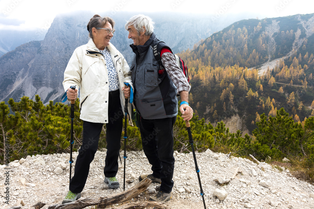 Senior Couple Moment of Affection While Resting on an Alpine Trail