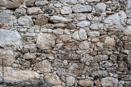 Gabion retaining wall made of concrete and stone in a mountainous terrain
