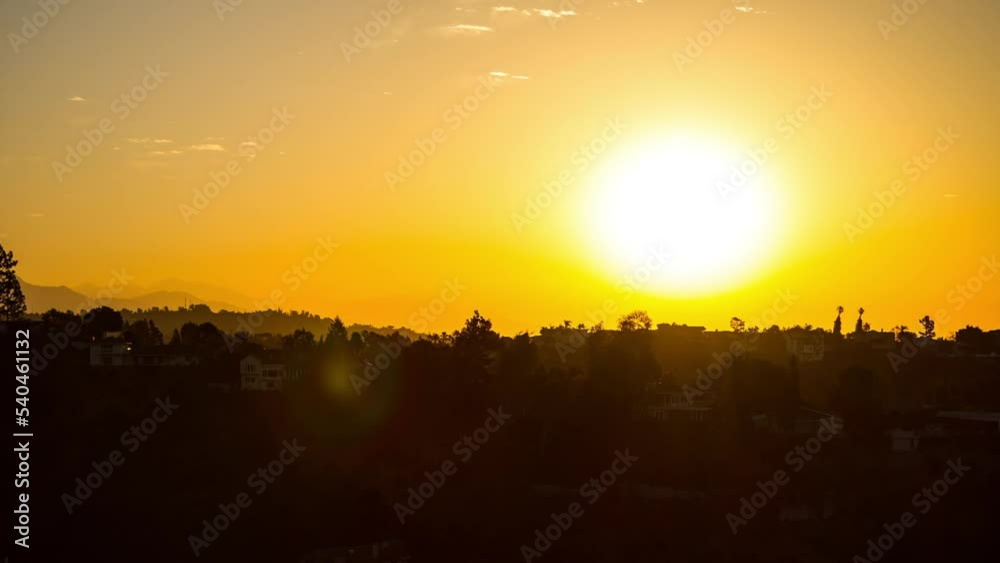 Lockdown Time Lapse Shot Of Residential Houses Amidst Trees In Town By Mountains During Sun Rising In Sky - Yosemite, California Lockdown Time Lapse Shot Of Residential Houses Amidst Trees In Town By Mountains During Sun Rising In Sky - Yosemite, California