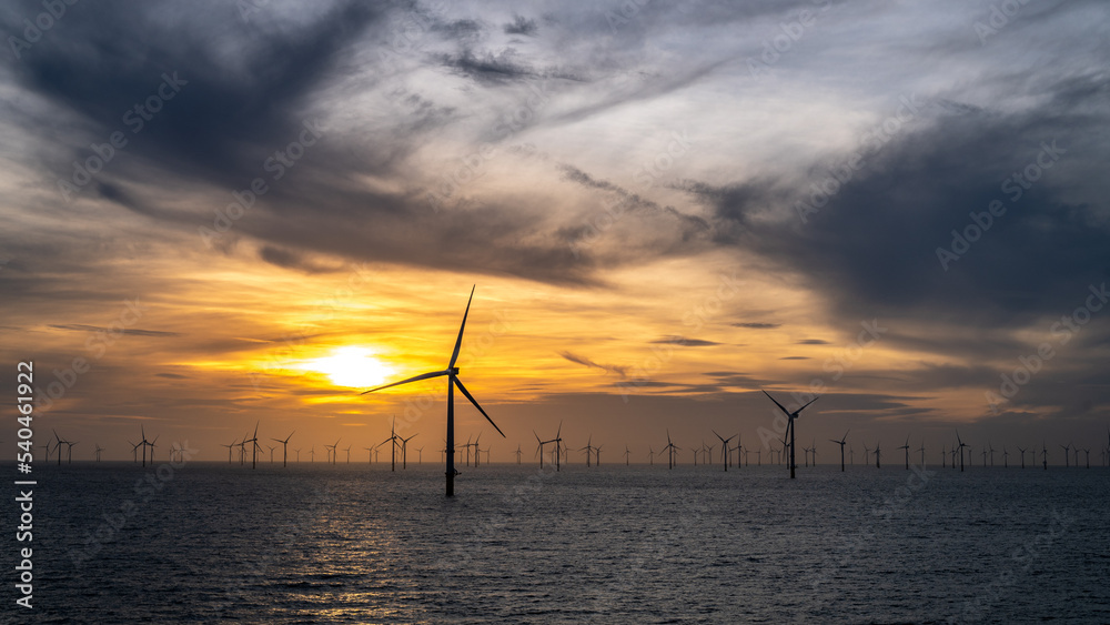 Different aspects of wonderful sunset offshore wind farm.